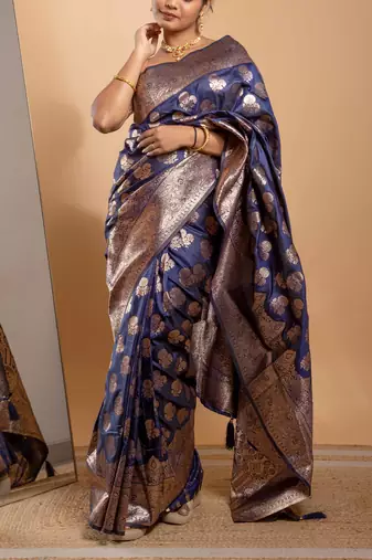 Navy blue zari woven saree with floral motifs and grand border