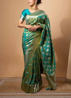 Turquoise green zari woven saree with intricate floral motifs 1