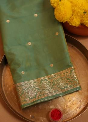 Turquoise green zari woven saree with intricate floral motifs 2