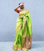 Lime green paithani saree with multicolor zari border