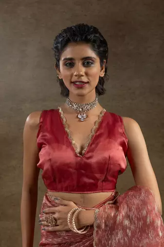 pre-stitched peach woven tissue crush saree