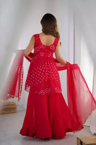 Crimson pink peplum kurta and flared palazzo set with dupatta