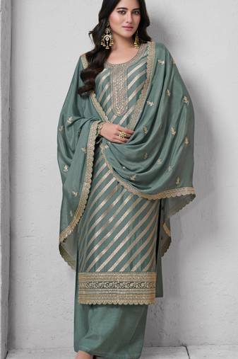 Green color lotus silk fanric beautiful partywear salwar kameez
