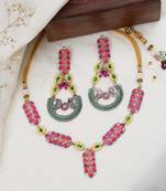 Bold red and green meenakari necklace with peacock motif earrings