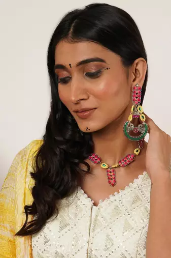 Bold red and green meenakari necklace with peacock motif earrings