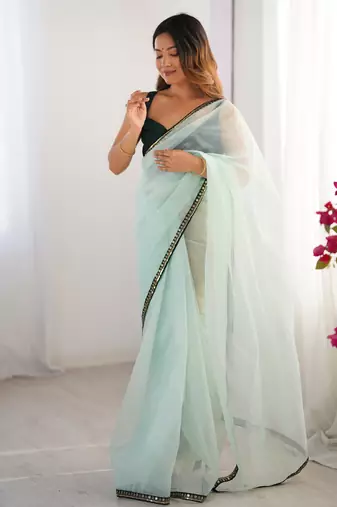Sea green twill net embroidered lace saree