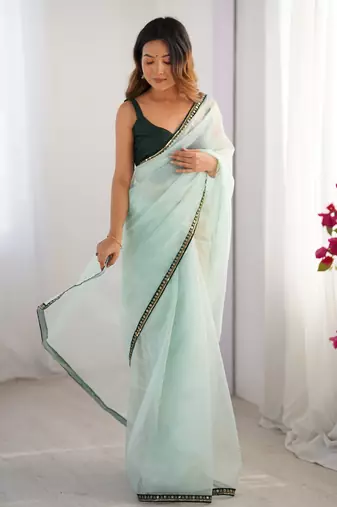 Sea green twill net embroidered lace saree