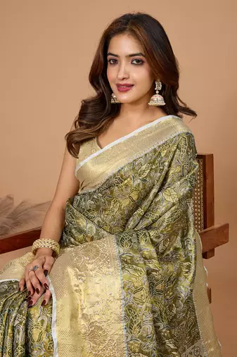Green soft silk blend woven zari saree