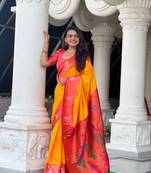 Orange paithani silk blend saree with zari weaving meenakari border