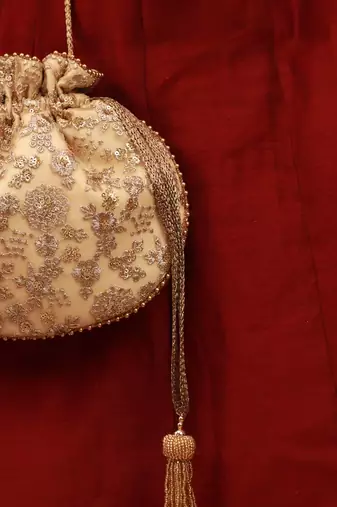 Ada embroidered potli - gold
