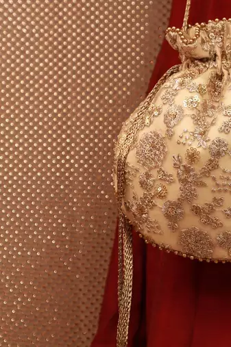 Ada embroidered potli - gold