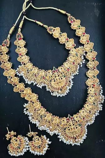 Gold-plated traditional goddess lakshmi temple jewellery bridal set with ruby stone long haram double Necklace :: set