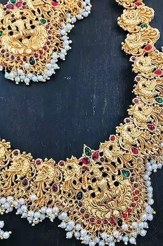 Gold-plated traditional goddess lakshmi temple jewellery bridal set with ruby stone long haram double Necklace :: set