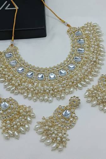 Luxurious kundan choker set with pearl and white bead accents - traditional indian bridal jewelry