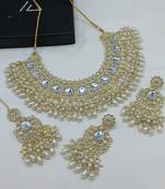 Luxurious kundan choker set with pearl and white bead accents - traditional indian bridal jewelry