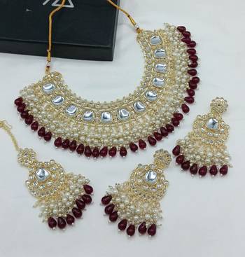 Luxurious kundan choker set with pearl and maroon bead accents - traditional indian bridal jewelry 1