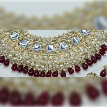 Luxurious kundan choker set with pearl and maroon bead accents - traditional indian bridal jewelry 2