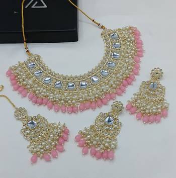 Luxurious kundan choker set with pearl and pink bead accents - traditional indian bridal jewelry 1