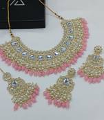 Luxurious kundan choker set with pearl and pink bead accents - traditional indian bridal jewelry