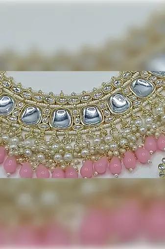 Luxurious kundan choker set with pearl and pink bead accents - traditional indian bridal jewelry