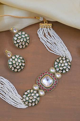 Luxury kundan pearl side necklace set - handcrafted indian bridal jewelry with green meenakari and ruby accents