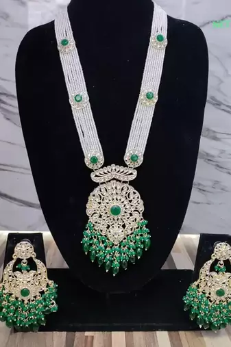 Emerald green beaded kundan necklace set with matching chandelier earrings traditional indian wedding jewelry collection