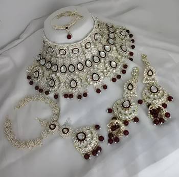 Luxurious maroon kundan bridal set - complete semi wedding jewelry collection with pearl embellishments 1