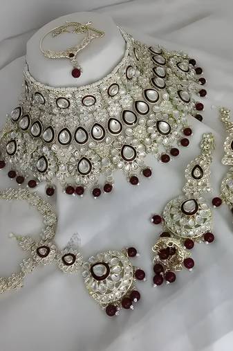 Luxurious maroon kundan bridal set - complete semi wedding jewelry collection with pearl embellishments