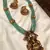 Luxurious emerald green temple goddess kundan jewelry set - handcrafted gold-plated bridal necklace with jhumka earrings