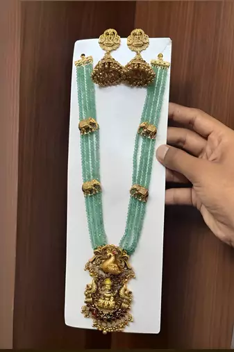 Luxurious emerald green temple goddess kundan jewelry set - handcrafted gold-plated bridal necklace with jhumka earrings