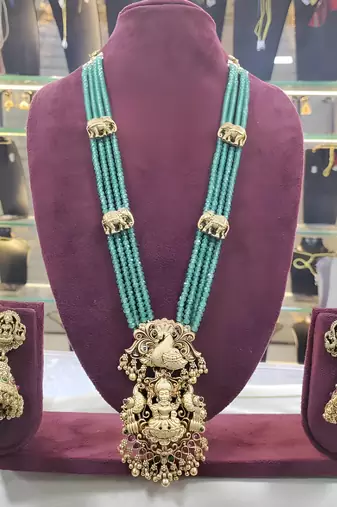 Luxurious emerald green temple goddess kundan jewelry set - handcrafted gold-plated bridal necklace with jhumka earrings