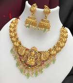 Opulent gold peacock lakshmi temple necklace set - handcrafted antique finish bridal jewelry with emerald & pearl accent