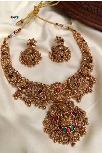Gold lakshmi temple necklace set - bridal jewelry with ruby and emerald accents