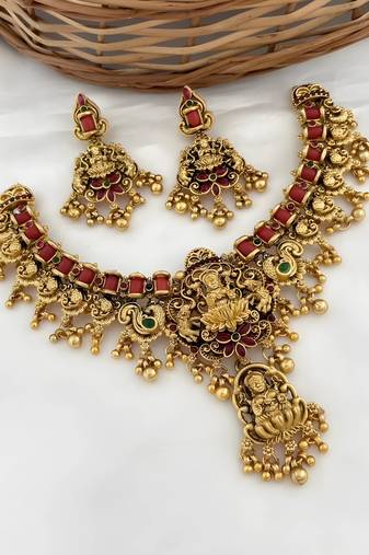 Opulent lotus lakshmi temple necklace set - antique gold kundan bridal jewelry with ruby and emerald accents