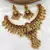 Opulent lotus lakshmi temple Necklace :: set - antique gold kundan bridal jewelry with ruby and emerald accents