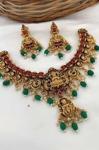 Luxurious lakshmi goddess temple jewelry necklace set - antique gold with emerald green and ruby red gemstones