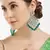 Luxurious emerald chandelier earrings - traditional indian statement jewelry for wedding & festival elegance