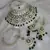 Luxurious green kundan bridal set - complete semi wedding jewelry collection with pearl embellishments