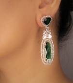Green rhodium plated green stone zircon studded dangler earrings