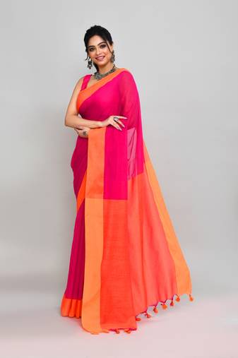 Orange border rani pink cotton saree with tassels