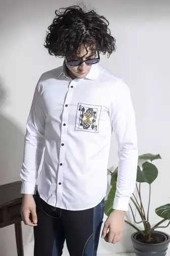White plain cotton men's shirt with black buttons