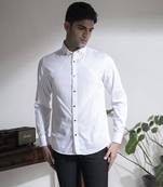 White plain cotton men's shirt with french cuffs and metal buttons.