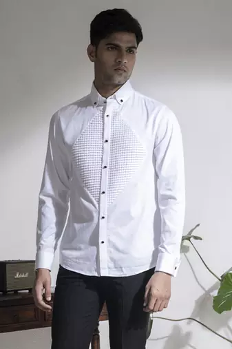 White plain cotton men's shirt with french cuffs and metal buttons.