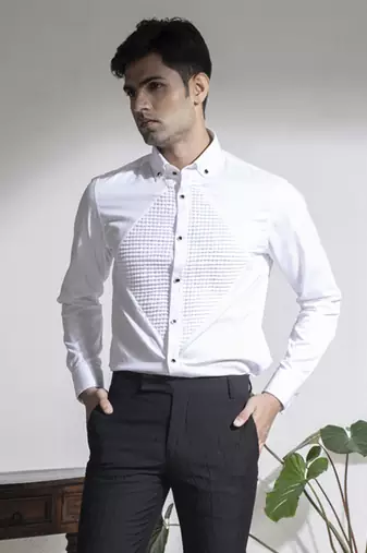 White plain cotton men's shirt with french cuffs and metal buttons.