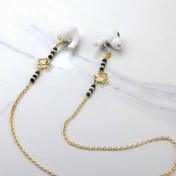 Golden flower with green beads spectacles/air pods chain 1