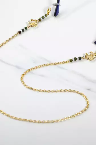 Golden flower with green beads spectacles/air pods chain