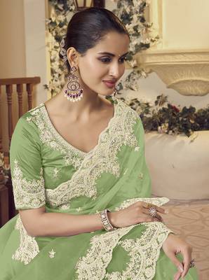Green micro net party wear embroidered saree with blouse fabric  2