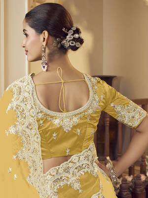 Yellow micro net party wear embroidered saree with blouse fabric  3