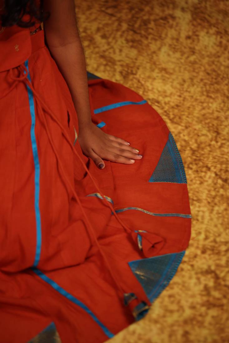 Orange cotton top and skirt set for girls.