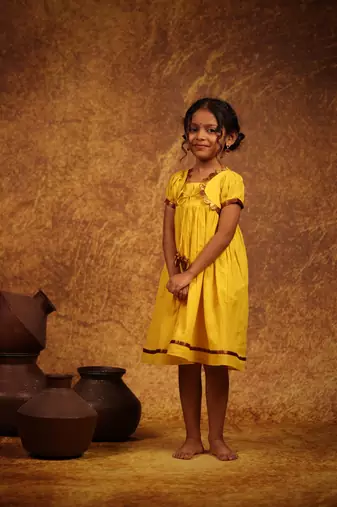 Yellow cotton dress with think kanchipuram border for girls